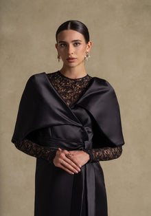 Eterna Set black gown from Zarina Collection, featuring satin wrap, lace inner, and cape overlay for luxury evening wear.