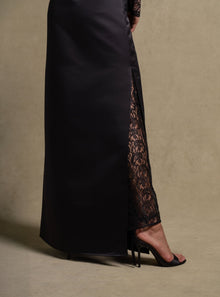 Eterna Set black gown showcasing satin wrap silhouette and lace detail, luxury evening wear fashion for women.