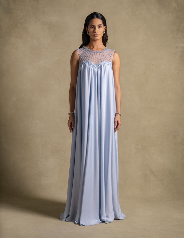 Noor Dress in baby blue, featuring a sheer embroidered neckline, perfect for evening wear and luxury occasions.