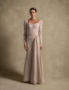 Evania Dress from Zarina Collection, a luxury beige gown with lace bodice and chiffon skirt, perfect evening wear.