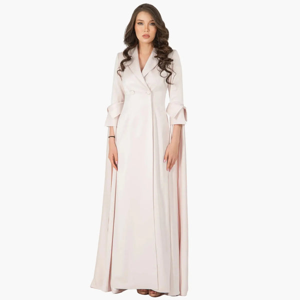 Elegant Rosanna Dress in powder pink crepe silk, featuring lapel collar and double-breasted front, ideal for evening wear.