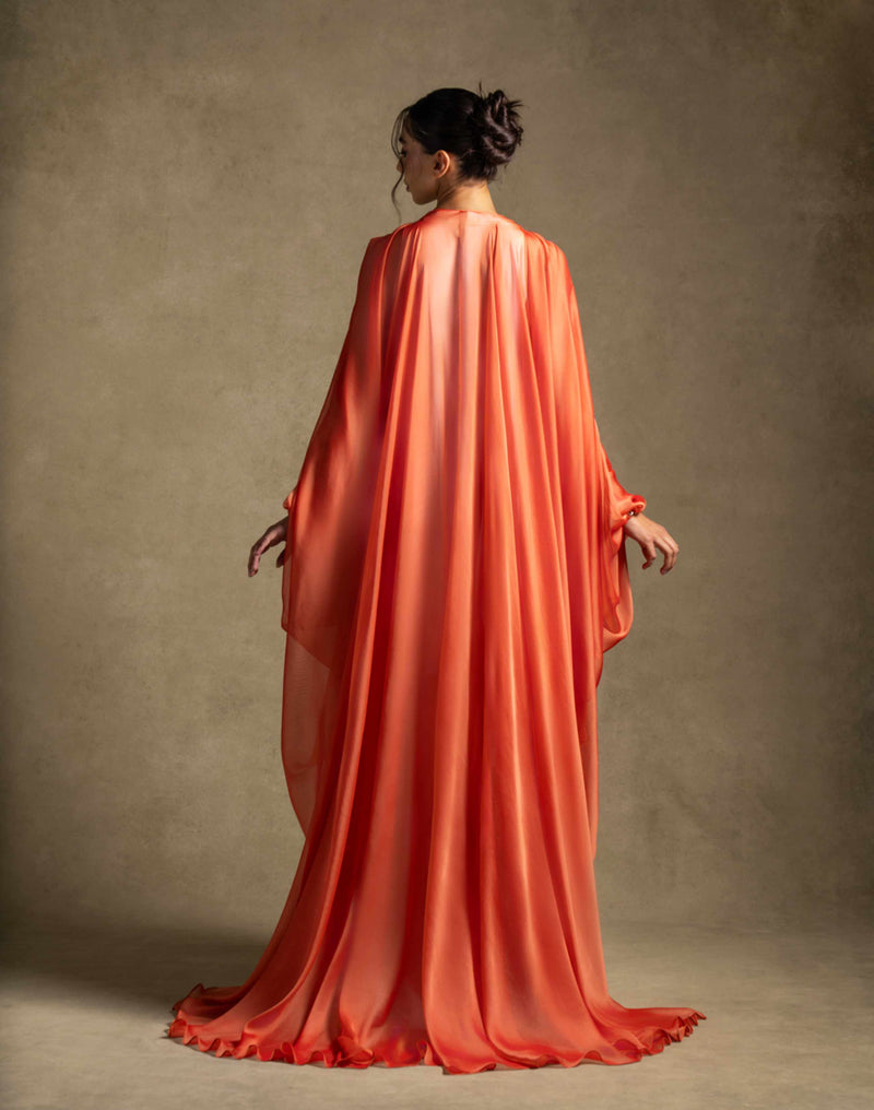 Laila Set flowing burnt orange organza abaya overlay, showcasing luxury women's clothing for evening wear.