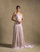 Avelisse Dress - elegant beige halter gown with pleating and beading, perfect evening wear maxi dress for women.