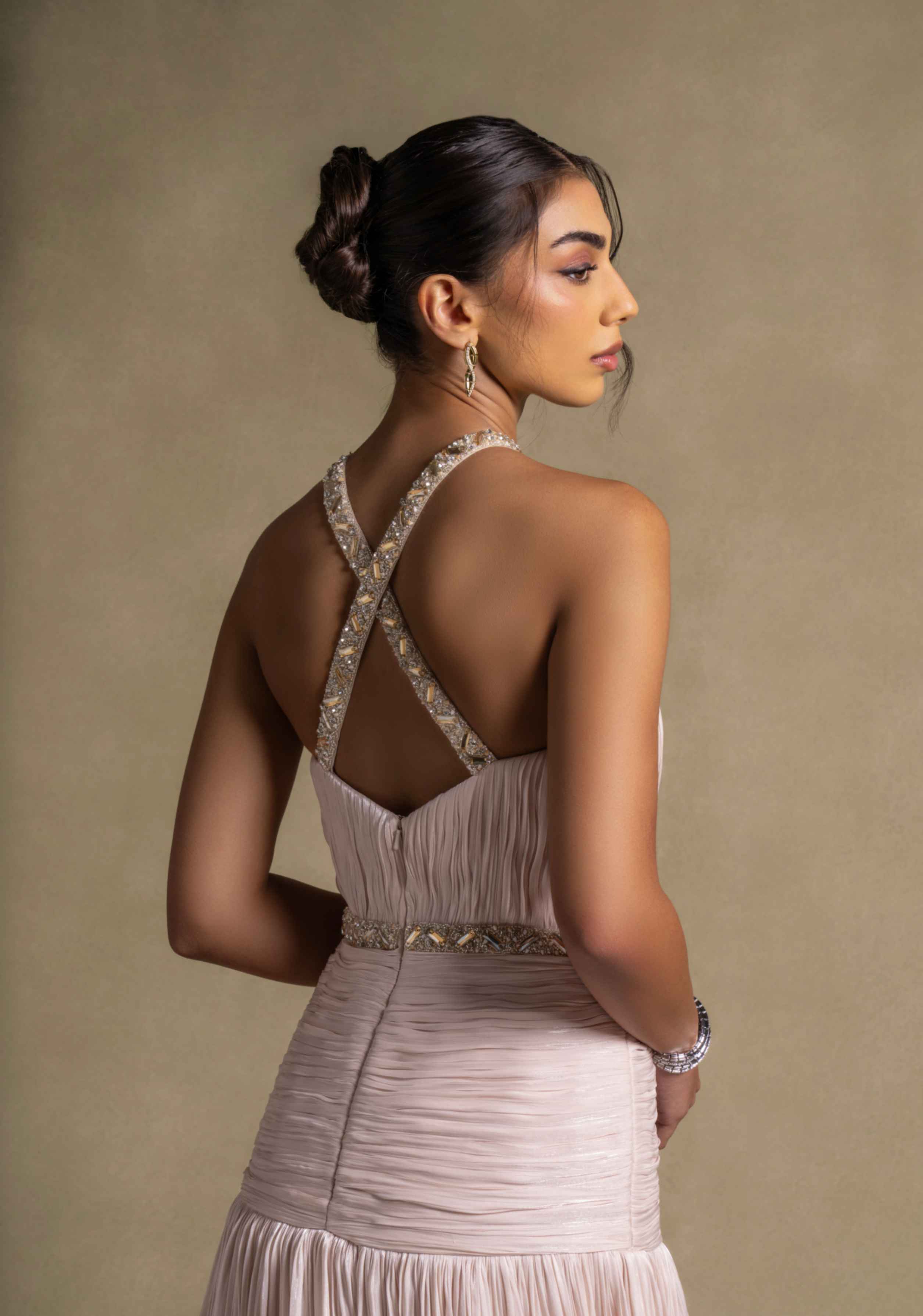 Avelisse Dress featuring a back view with intricate beading and elegant pleating, perfect for evening wear.