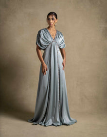 Cyra Dress in sage green, featuring a gathered bodice and soft volume sleeves, perfect evening wear for high end fashion.