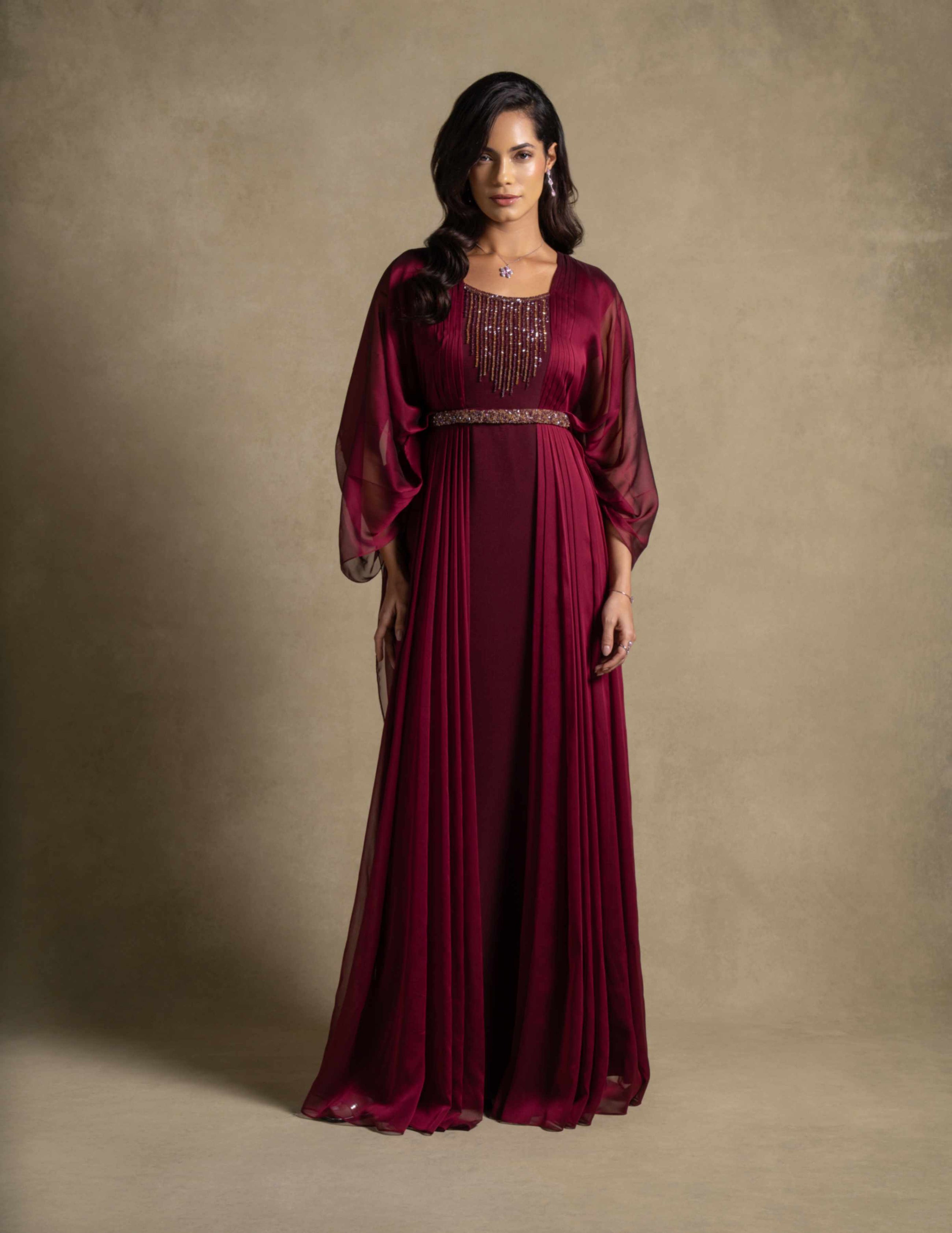 Burgaya Dress in maroon with chiffon overlay and beaded neckline, perfect for evening wear and formal occasions.