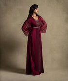 Burgaya Dress in maroon with chiffon overlay, beaded neckline, and sheer sleeves for elegant evening wear.