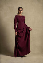 Roxana Dress in maroon from the Zarina Collection, featuring elegant draped detailing and embellished neckline for evening wear.