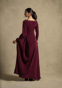 Roxana Dress featuring refined draped detailing and an embellished neckline, perfect for luxury evening wear.