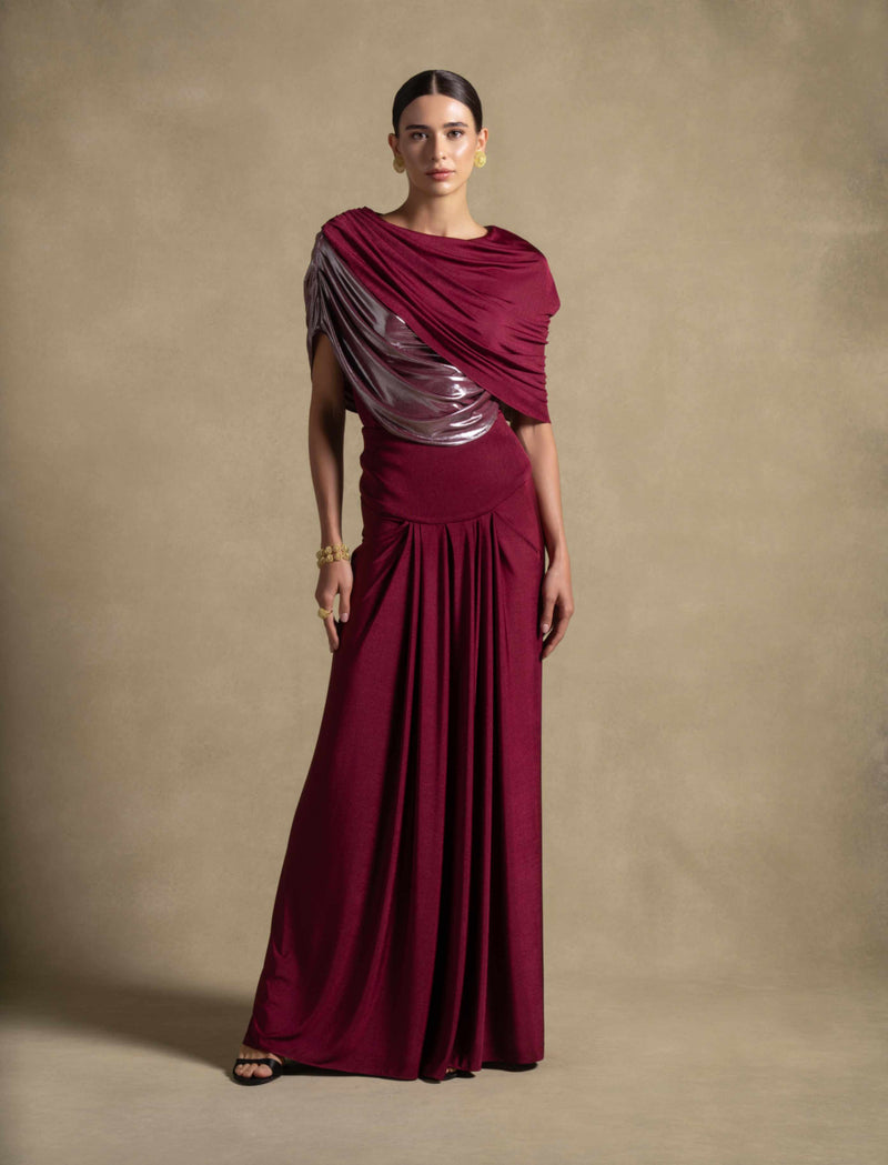 Diana Set in maroon gown, featuring asymmetric draped bodice and metallic detailing, perfect for high-end fashion evening wear.