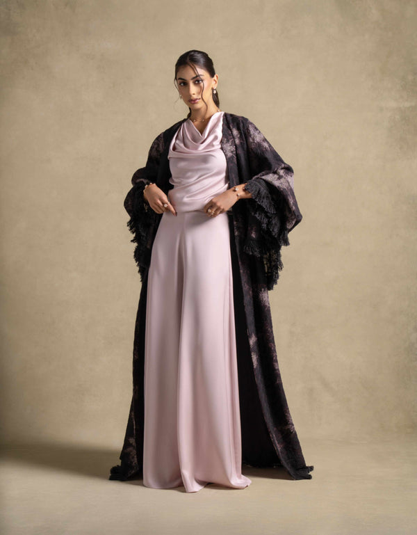 Elegant model wearing the Layana Set, a luxury pink quartz pantsuit from the Zarina Collection for modern evening wear.