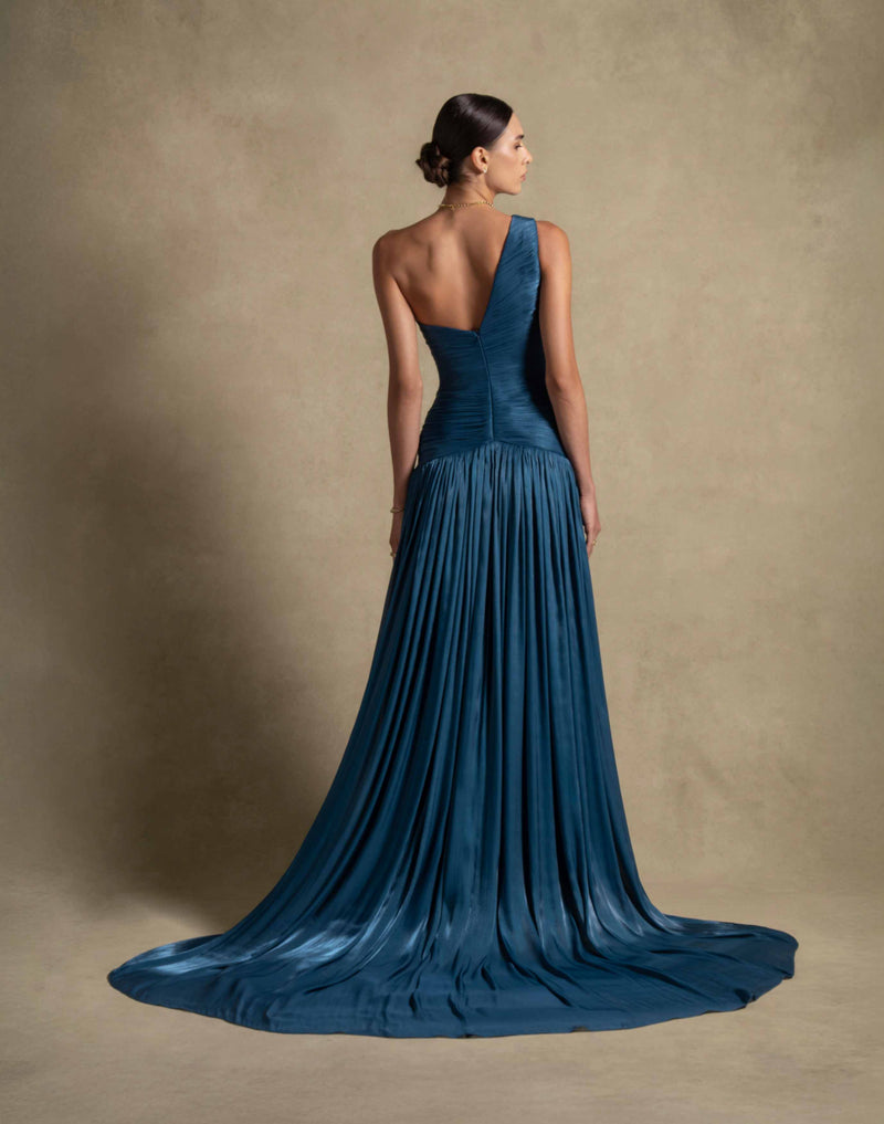Layali Dress in turquoise from Zarina Couture, featuring a one-shoulder design and flowing train, ideal for luxury evening wear.