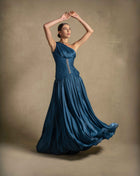 Layali Dress in turquoise, featuring a one-shoulder design and flowing skirt, perfect for evening wear and luxury occasions.