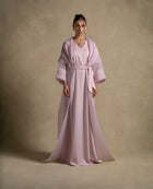 Isis Set showcasing a luxurious pink quartz maxi dress with a belted waist and sheer organza overlay, perfect for evening wear.