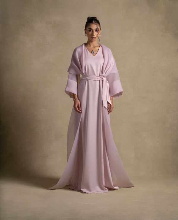 Isis Set showcasing a luxurious pink quartz maxi dress with a belted waist and sheer organza overlay, perfect for evening wear.