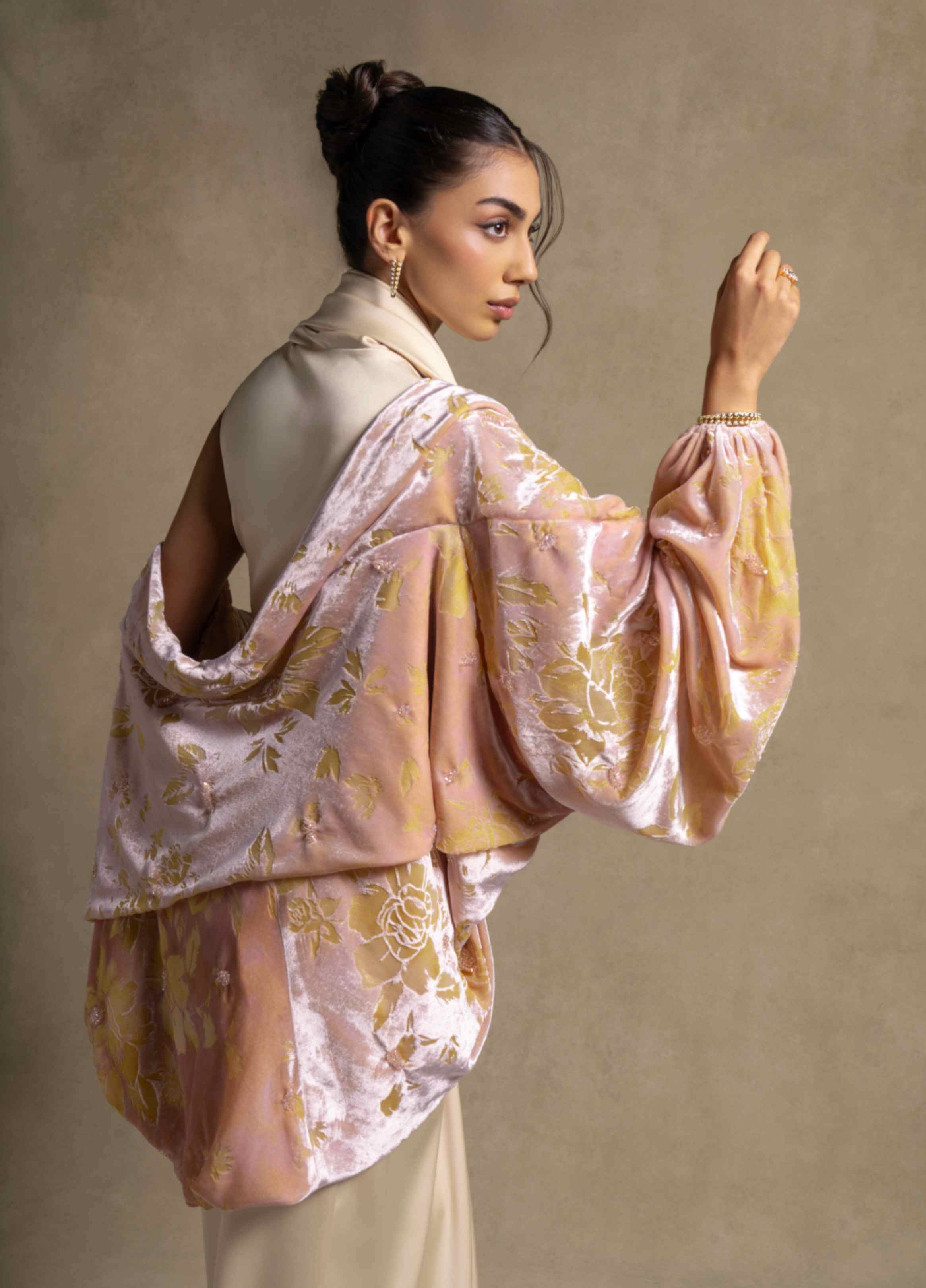 Selene Set showcasing a layered cape with floral patterns, paired with a satin gown, exemplifying luxury evening wear for women.