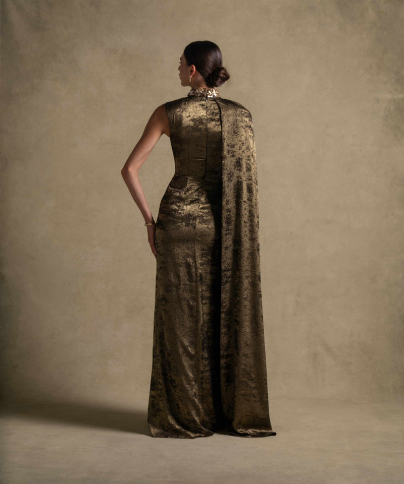 Grace Dress in rich Fatigue green showcases a sculpted silhouette and cape overlay, perfect for high-end fashion events.
