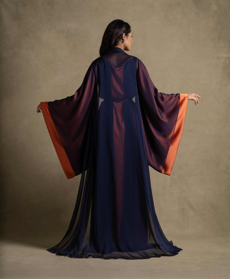 Irene Set flowing maxi dress in navy blue and tangerine with chiffon overlay, perfect for evening wear and high-end fashion.