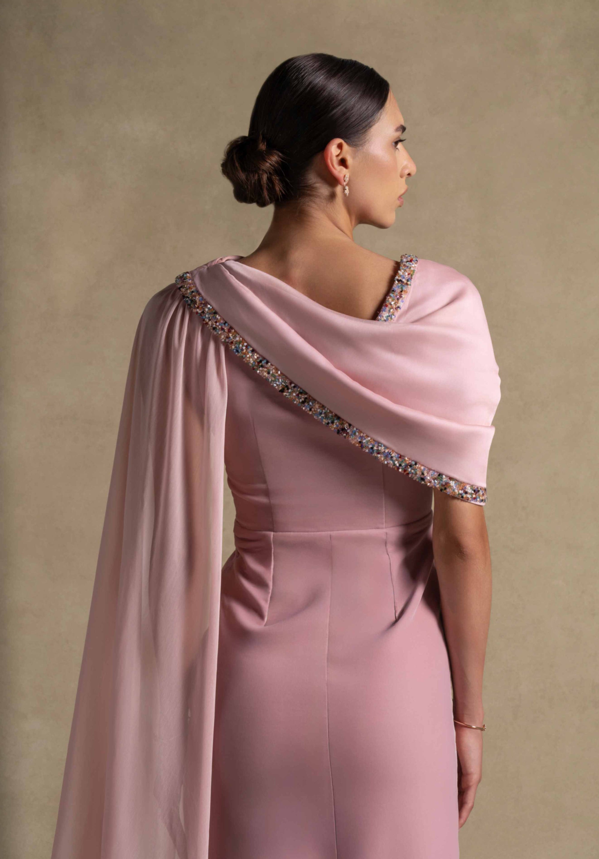 Meghan Dress showcasing soft Pink Quartz velvet with chiffon drape and beaded neckline, perfect for luxury evening wear.