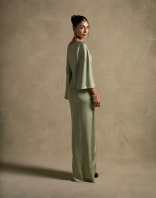 Renee Dress in pistachio color, showcasing luxury evening wear with draped sleeves and an elegant silhouette.
