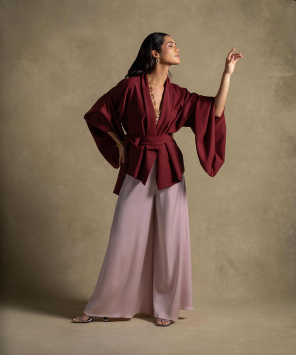 Zaria Set featuring a structured maroon wrap top and flowing blush wide-leg trousers, perfect for luxury evening wear.