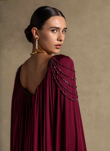Vionna Dress features a deep Maroon color, beaded shoulder accents, and draped jersey panels for luxury evening wear.