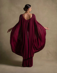 Vionna Dress in deep maroon showcasing sculpted bodice and draped jersey, perfect for luxury evening wear.