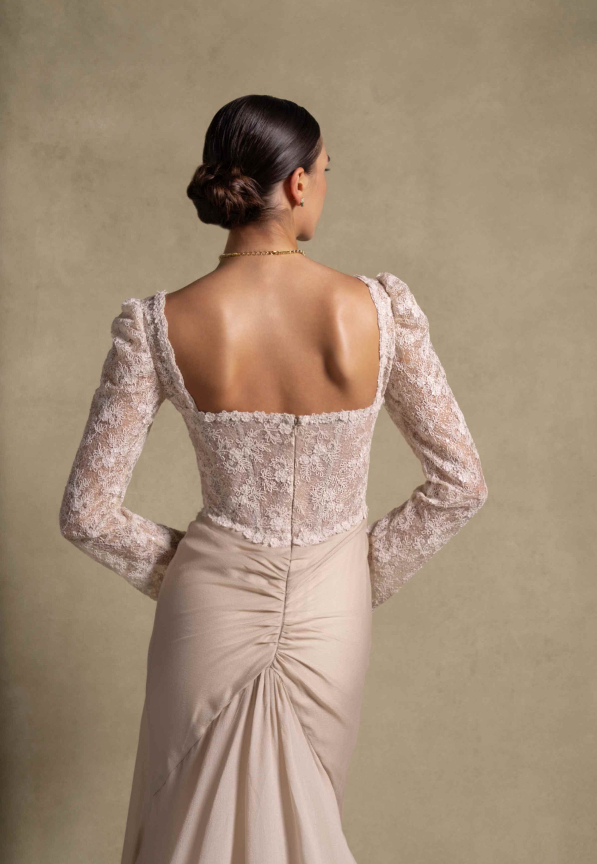 Evania Dress back view showcasing its fitted lace bodice and delicate draped chiffon skirt, perfect for luxury evening wear.