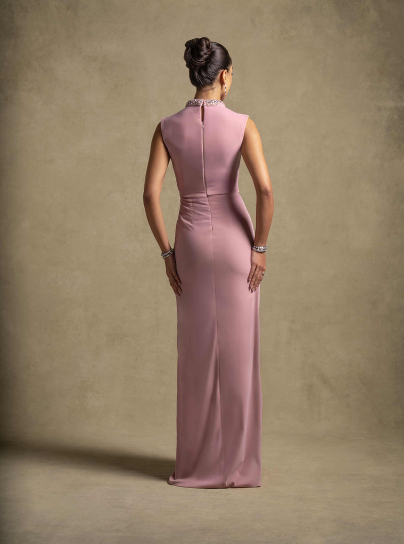 Ladan Dress in Pink Quartz, a luxury sleeveless gown with high neckline and draped panel, perfect for evening wear.