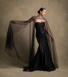 Neriah Set couture black gown with sweetheart neckline and sheer tulle cape, showcasing luxury evening wear in high-end fashion.