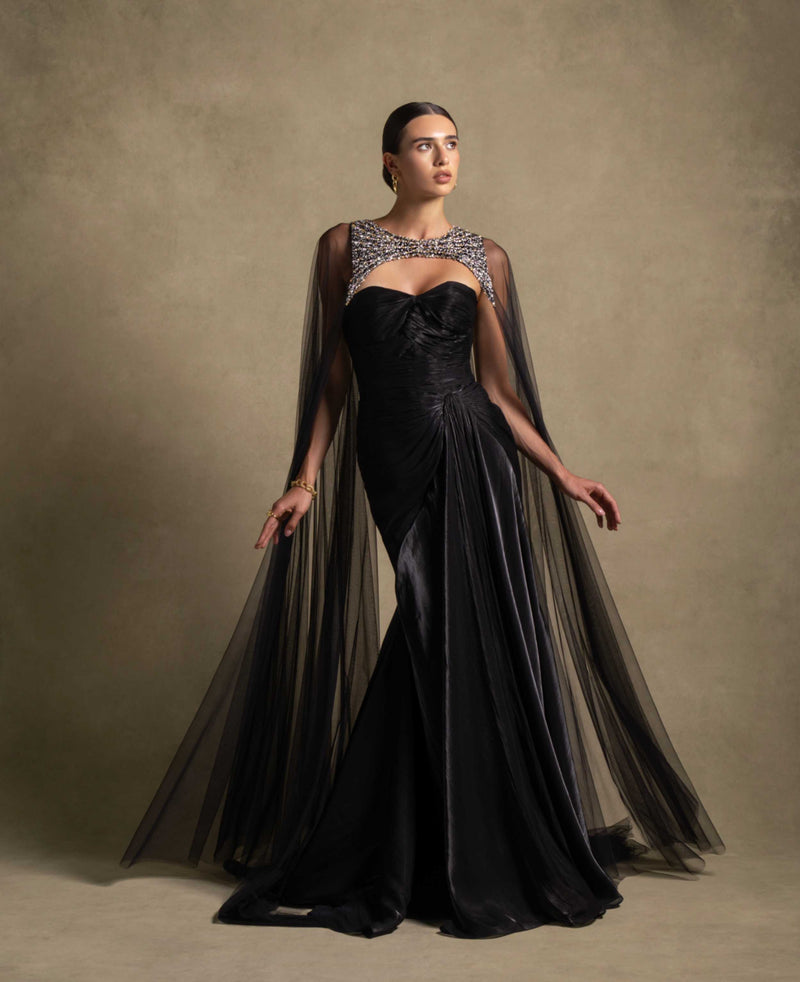 Neriah Set black gown from Zarina Collection featuring a sweetheart neckline and sheer tulle cape, perfect for luxury evening wear.